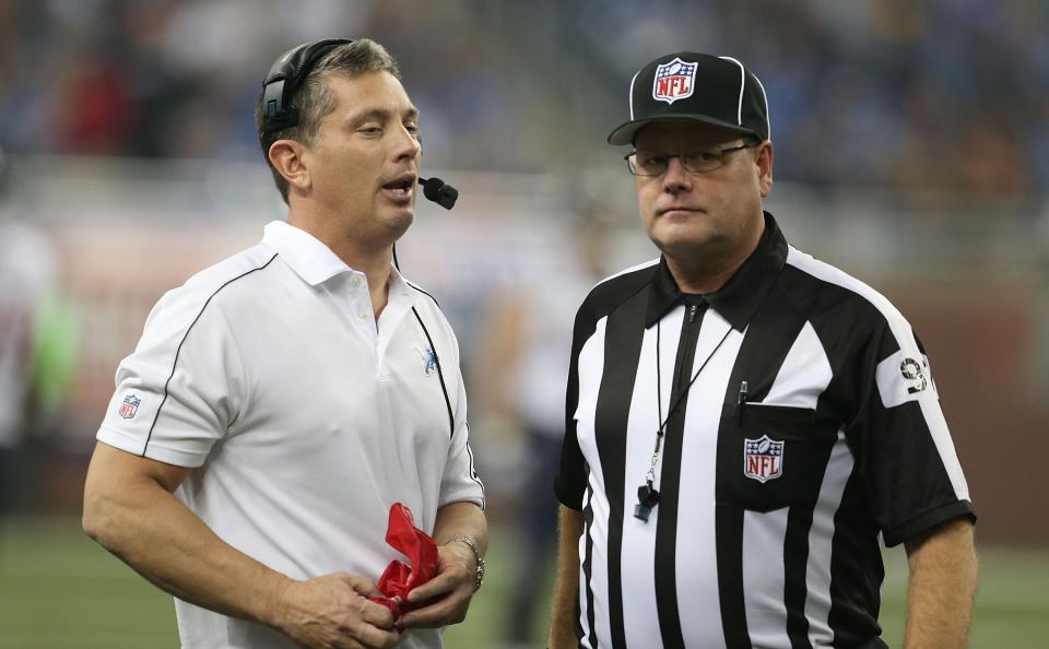 DETROIT, MI - NOVEMBER 22: Detroit Lions head coach Jim Schwartz (L) talks with NFL official Jerry Bergman during a disputed play during the game against the Houston Texans at Ford Field on November 22, 2012 in Detroit, Michigan. The Texans defeated the Lions 34-31. (Photo by Leon Halip/Getty Images)