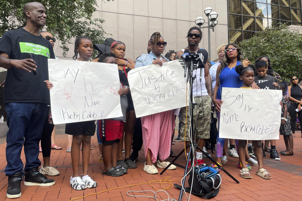 FILE - Family members of Ricky Cobb II, a Black man who was shot and killed by a Minnesota State Patrol trooper, speak at a news conference outside Hennepin County Government Center, Aug. 2, 2023, in Minneapolis. On Wednesday, Jan. 24, 2024, prosecutors charged Minnesota State Patrol Trooper Ryan Londregan with murder and two other counts in the shooting death of Cobb during a stop in July 2023. (AP Photo/Trisha Ahmed, File)