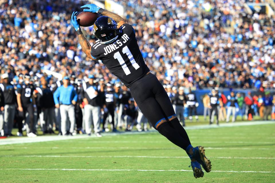 Jacksonville Jaguars wide receiver Marvin Jones Jr. (11) scores a touchdown during the third quarter of a regular season NFL football matchup Sunday, Dec. 18, 2022 at TIAA Bank Field in Jacksonville. The Jacksonville Jaguars edged the Dallas Cowboys 40-34 in overtime. [Corey Perrine/Florida Times-Union]