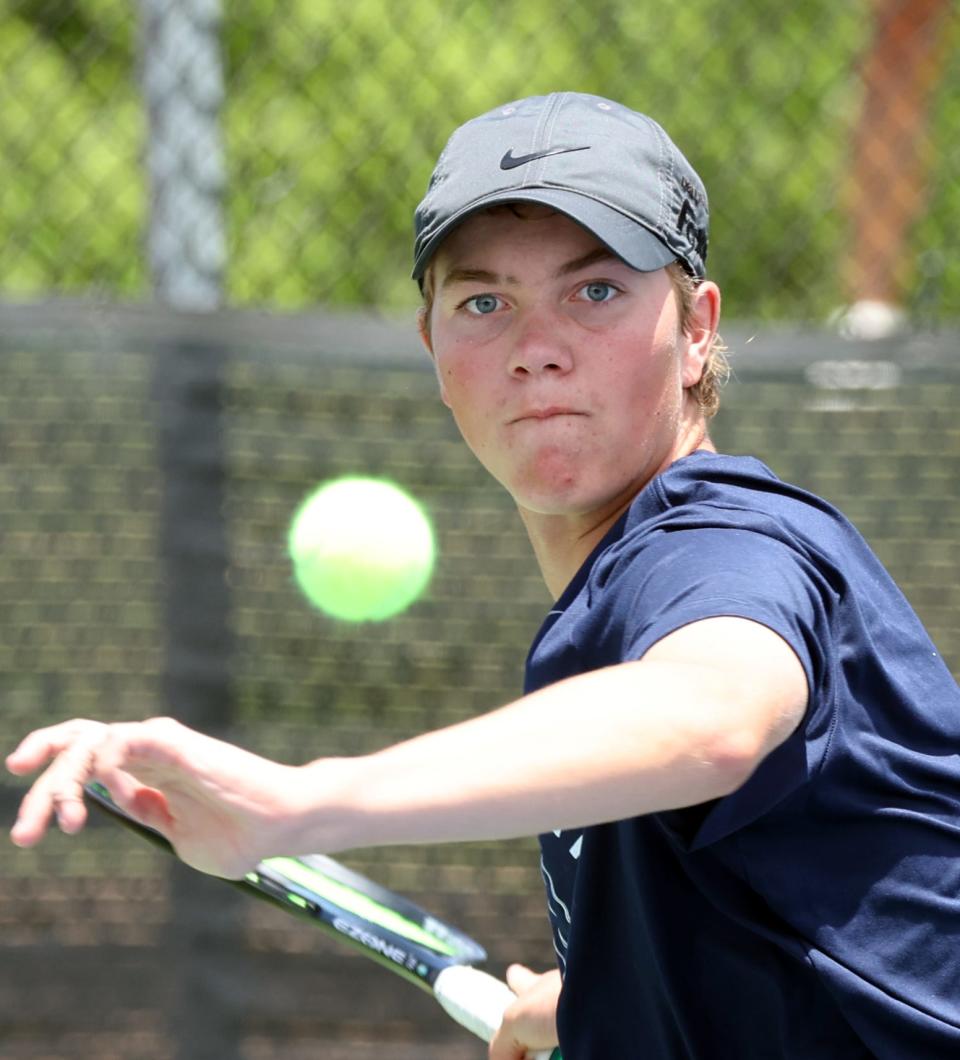 Edmond North's Jack Franklin returns a ball as he and doubles partner Dillon Rainwater play Mustang's Jaden Le and Cristian Salas on Friday at OKC Tennis Center.