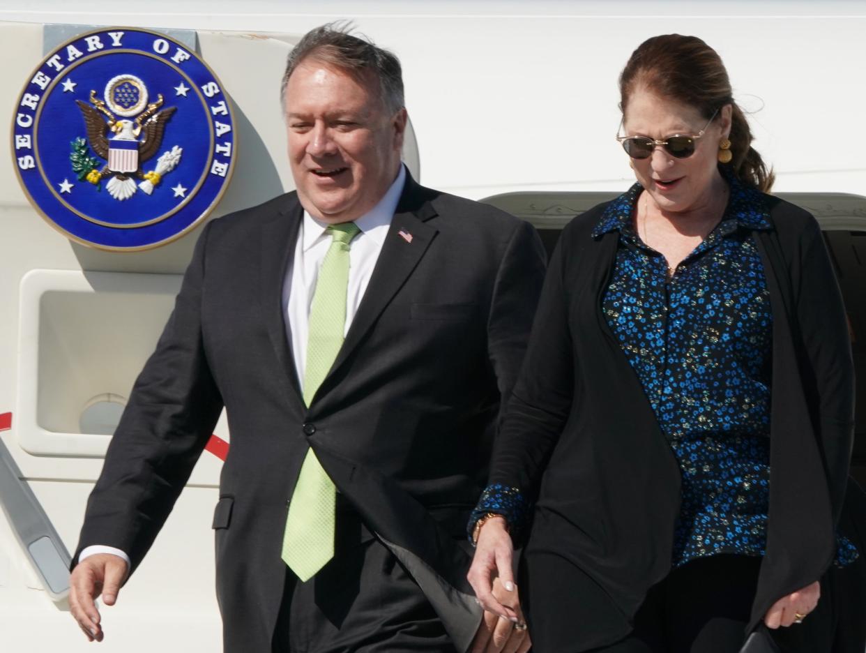 <p>US Secretary of State Mike Pompeo (L) and his wife Susan disembark their plane at Warsaw's Chopin airport as they arrive for a day visit to Poland, on August 15, 2020</p> (Photo by JANEK SKARZYNSKI/AFP via Getty Images)