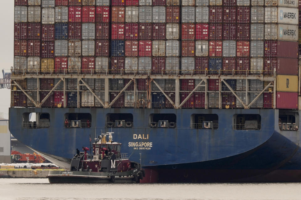 Tugboats escort the cargo ship Dali after it was refloated in Baltimore, Monday, May 20, 2024. The vessel on March 26 struck the Francis Scott Key Bridge causing it to collapse and resulting in the death of six people. (AP Photo/Matt Rourke)