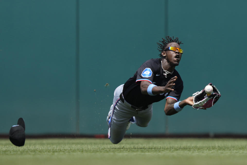 Miami Marlins outfielder Jazz Chisholm Jr. catches a fly ball hit my Washington Nationals CJ Abrams during the fifth inning of a baseball game at Nationals Park in Washington, Sunday, June 16, 2024. (AP Photo/Susan Walsh)