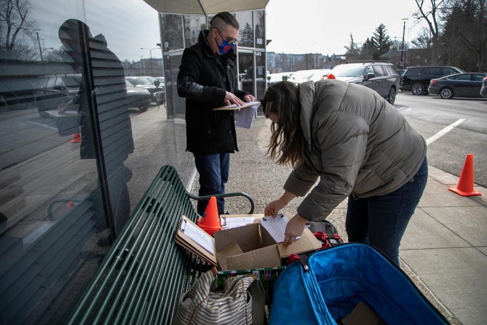 In this file photo, volunteers help with drive-thru Narcan training on Feb. 26, 2021. Narcan is a nasal-spray drug used to reverse opioid overdoses.