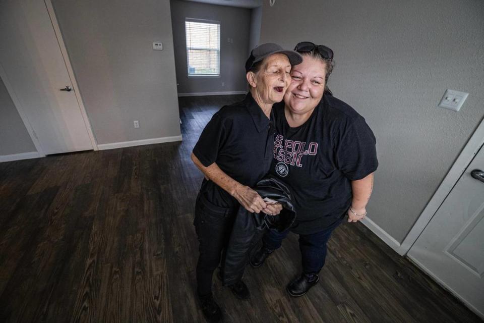 Carol, left, and Amber Rogers react after seeing their new apartment in Saginaw on Tuesday, Nov. 21, 2023. For about four years, Carol and her daughter-in-law Amber have been living in low-cost hotels, motels and even storage units. With the help of the nonprofit organization Community Link, the Rogers were able to move into an apartment just before Thanksgiving. Chris Torres/ctorres@star-telegram.com