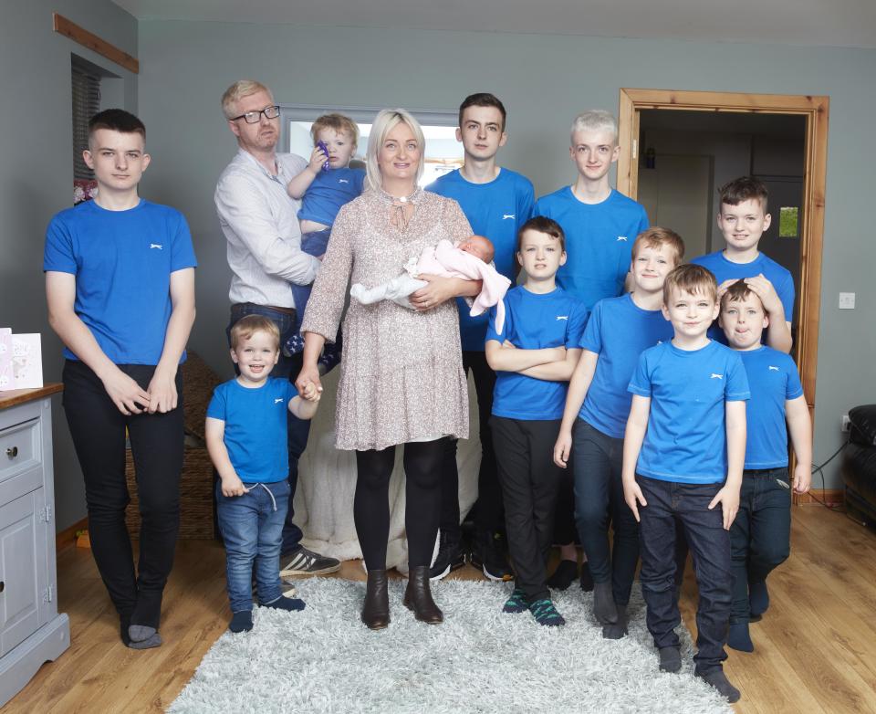 Alexis and David Brett photographed alongside their 10 sons and newborn daughter, Cameron [Photo: Caters]