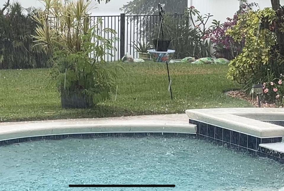 Hail falls during a Saturday afternoon storm in Vero Beach on May 18, 2024.