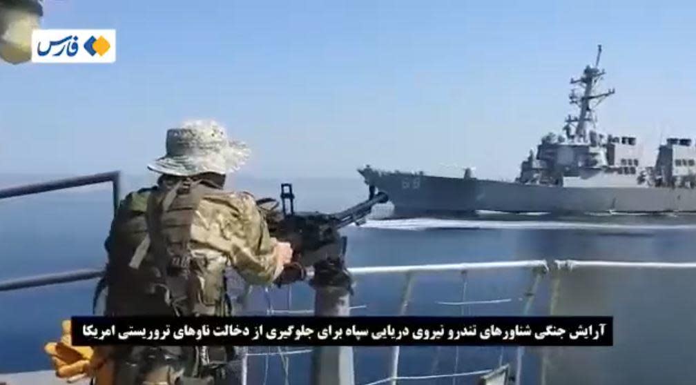 An image taken from video posted online by Iran's Fars News Agency, which is controlled by the country's Islamic Revolutionary Guard Corps (IRGC), purportedly shows an encounter between a U.S. Navy warship and IRGC forces in the Gulf of Oman. Iranian media said the incident occurred near the end of October, 2021. / Credit: Fars News Agency