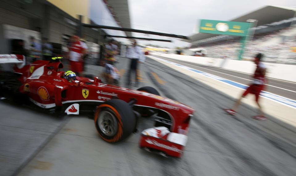 Ferrari Formula One driver Felipe Massa of Brazil drives out of his garage during the third practice session of the Japanese F1 Grand Prix at the Suzuka circuit October 12, 2013. REUTERS/Issei Kato (JAPAN - Tags: SPORT MOTORSPORT F1 TPX IMAGES OF THE DAY)