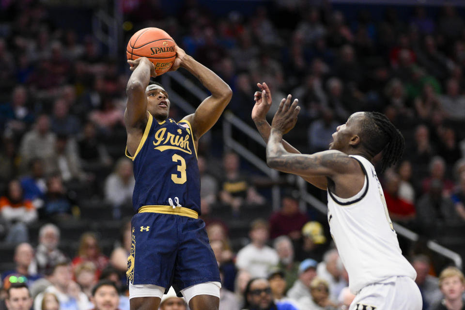 Notre Dame guard Markus Burton shoots over Wake Forest guard Kevin Miller during the first half of an NCAA college basketball game in the second round of the Atlantic Coast Conference tournament, Wednesday, March 13, 2024, in Washington. (AP Photo/Nick Wass)