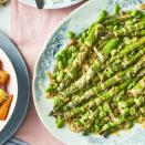 <p>This vibrant summer side dish contains in-season broad beans and asparagus. Be sure to make a double batch of the garlic tahini sauce, it's that addictive! </p><p><strong>Recipe: <a href="https://www.goodhousekeeping.com/uk/food/recipes/a39627985/griddled-asparagus-broad-beans-tahini/" rel="nofollow noopener" target="_blank" data-ylk="slk:Griddled asparagus with broad beans and tahini;elm:context_link;itc:0;sec:content-canvas" class="link ">Griddled asparagus with broad beans and tahini</a></strong></p>