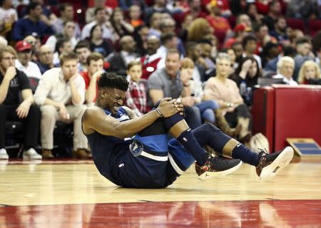 Feb 23, 2018; Houston, TX, USA; Minnesota Timberwolves guard Jimmy Butler (23) reacts after an apparent injury during the third quarter against the Houston Rockets at Toyota Center. Mandatory Credit: Troy Taormina-USA TODAY Sports