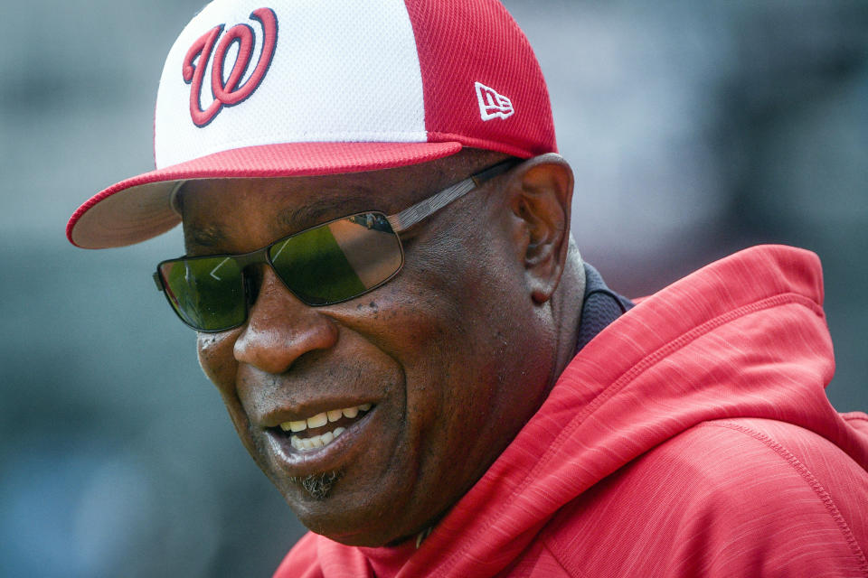 FILE - In this April 18, 2017, file photo, Washington Nationals manager Dusty Baker watches batting practice before the team's baseball game against the Atlanta Braves in Atlanta. A person with knowledge of the negotiations said Tuesday, Jan. 28, 2020, that Baker, 70, is working to finalize an agreement to become manager of the Houston Astros. The person spoke on condition of anonymity because the deal has not yet been completed. (AP Photo/John Amis)