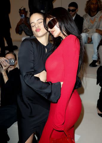 <p>Aitor Rosas Sune/WWD via Getty</p> Kylie Jenner and Rosalia pose together at Acne Studios Ready To Wear Spring 2024 show in Paris.