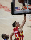 Atlanta Hawks' Bogdan Bogdanovic (13) shoots and scores during the first half of Game 3 of the NBA Eastern Conference basketball finals against Milwaukee Bucks Sunday, June 27, 2021, in Atlanta. (AP Photo/Brynn Anderson)