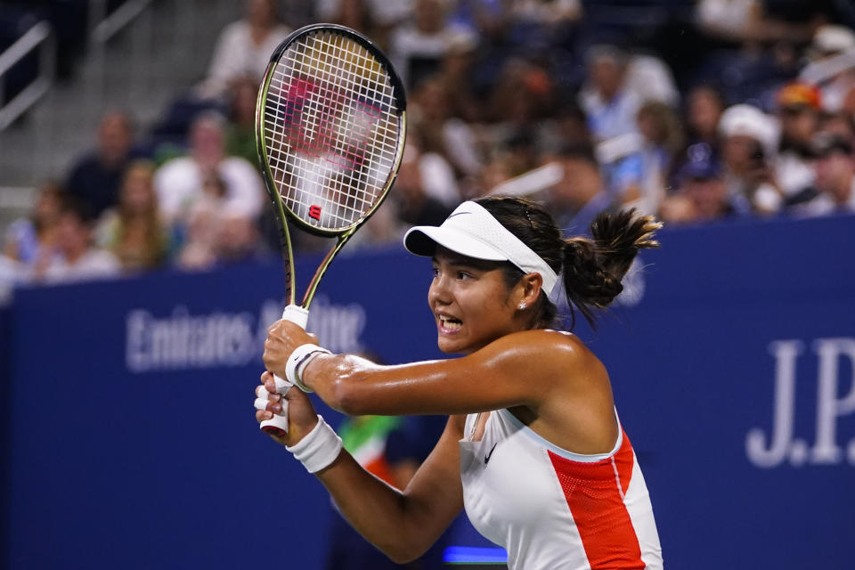 Emma Raducanu, of Britain, returns a shot to Alize Cornet, of France, during the first round of the US Open tennis championships, Tuesday, Aug. 30, 2022, in New York. (AP Photo/Frank Franklin II)