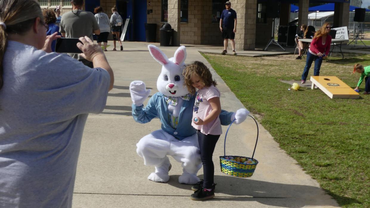 The Easter Bunny gives out eggs and poses for pictures during an Easter egg hunt at Sleepy Hollow Athletic Complex in Leesburg in 2019.