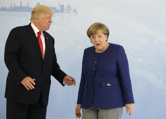 German Chancellor Angela Merkel (R) and US President Donald Trump  pose for a photo prior to a bilateral meeting on the eve of the G20 summit in Hamburg, northern Germany, on July 6, 2017. Leaders of the world's top economies will gather from July 7 to 8, 2017 in Germany for likely the stormiest G20 summit in years, with disagreements ranging from wars to climate change and global trade. / AFP PHOTO / Pool AP / Matthias Schrader        (Photo credit should read MATTHIAS SCHRADER/AFP/Getty Images)