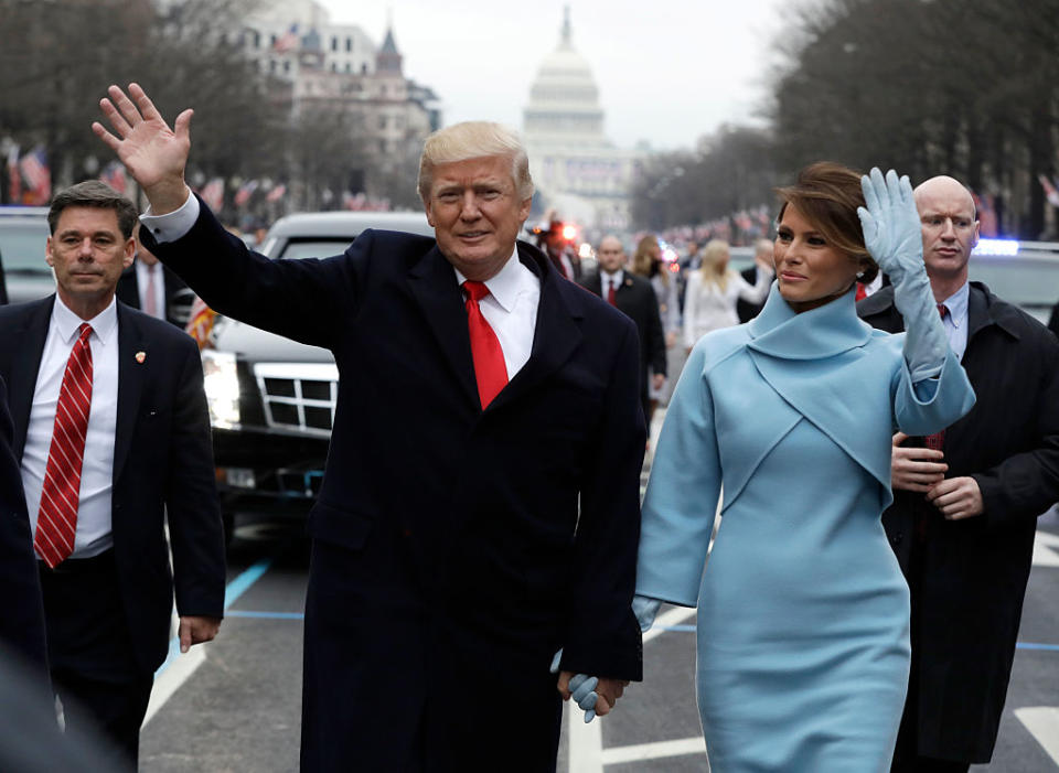 U.S. President Donald Trump waves to supporters along the parade route with first lady Melania Trump and son Barron Trump after being sworn in at the 58th Presidential Inauguration January 20, 2017 in Washington, D.C. | Pool—Getty Images