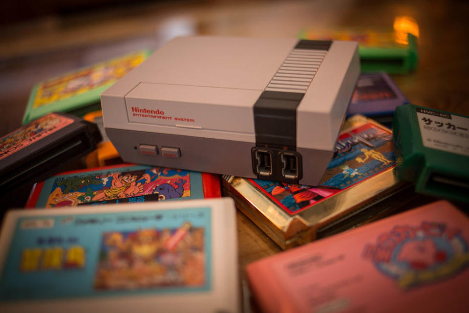 A Nintendo game console surrounded by cartridges