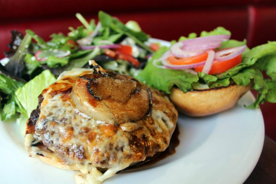The decadent Rossini burger at Django features foie gras torchon, black truffle, demi-glace and Gruyère.