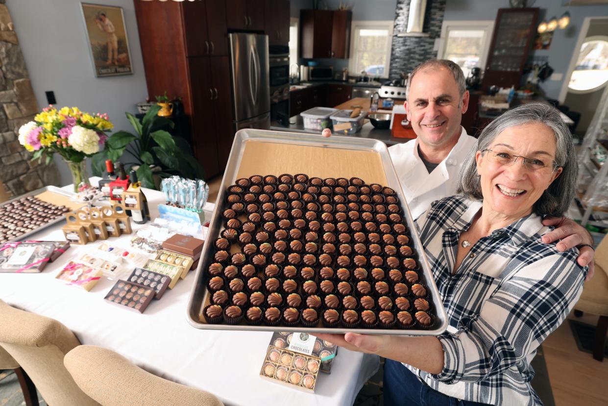 Rockhead Chocolates owner Elizabeth McConville Poussier and her husband chief chocolatier Jean-Marc Poussier make chocolate in their home kitchen in Easton on Monday, March 27, 2023.
