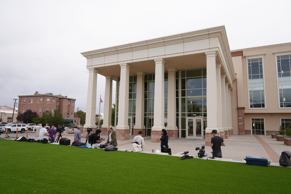 The media gathers outside of the First Judicial District Court of New Mexico where Alec Baldwin participated in a pretrial hearing, Monday, July 8, 2024, in Santa Fe, NM. Baldwin is facing a single charge of involuntary manslaughter in the death of a cinematographer. (AP Photo/Ross D. Franklin)