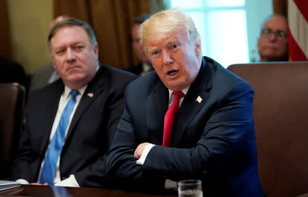 FILE PHOTO: U.S. President Donald Trump addresses members of his cabinet and the news media as Secretary of State Mike Pompeo looks on during a cabinet meeting at the White House in Washington, U.S., August 16, 2018. REUTERS/Kevin Lamarque