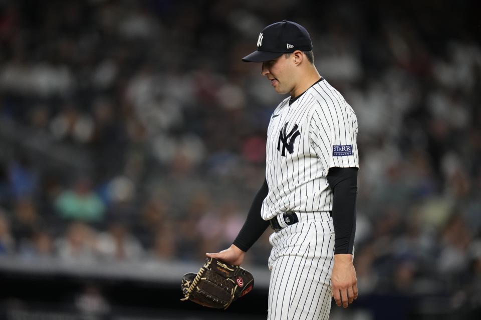 New York Yankees relief pitcher Tommy Kahnle leaves the field after the top of eighth inning of the team's baseball game against the Washington Nationals on Tuesday, Aug. 22, 2023, in New York. (AP Photo/Frank Franklin II)