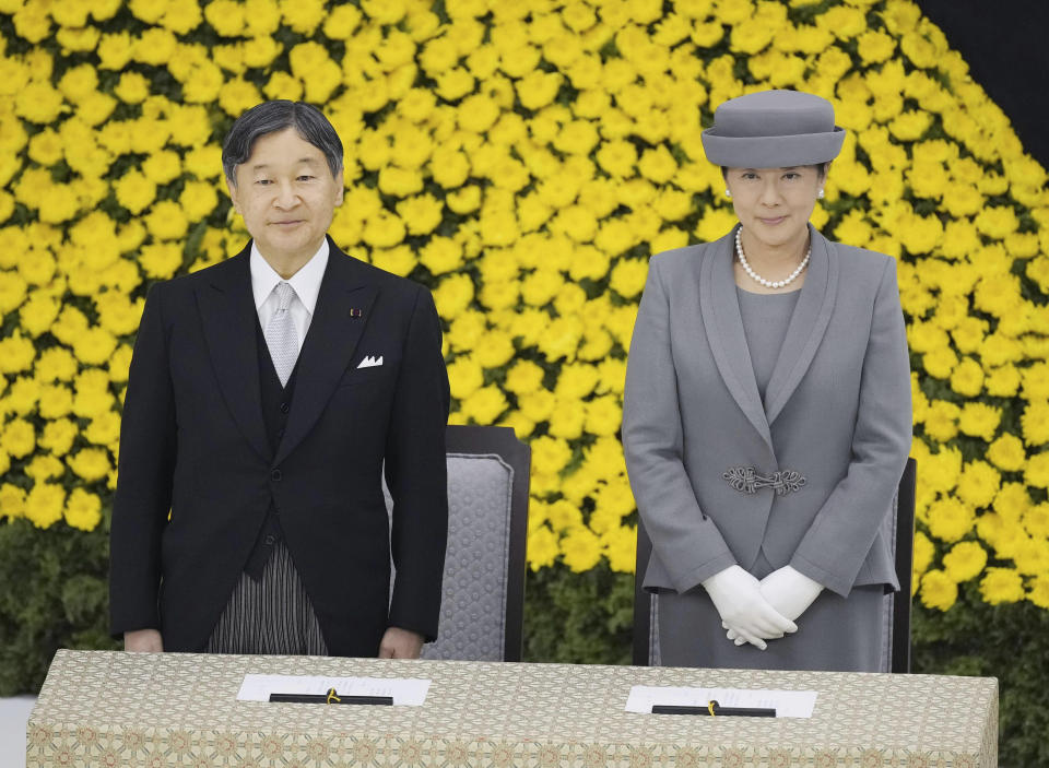 Japanese Emperor Naruhito, left, and Empress Masako, right, attend the memorial ceremony for the war dead at the Nippon Budokan hall in Tokyo, Tuesday, Aug. 15, 2023. Japan held the annual memorial service for the war dead as the country marks the 78th anniversary of its defeat in the World War II.(Kyodo News via AP)