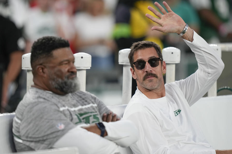 New York Jets quarterback Aaron Rodgers waves to fans before an NFL football game against the Kansas City Chiefs on Sunday Oct. 1, 2023, in East Rutherford, NJ. (AP Photo/Bryan Woolston)