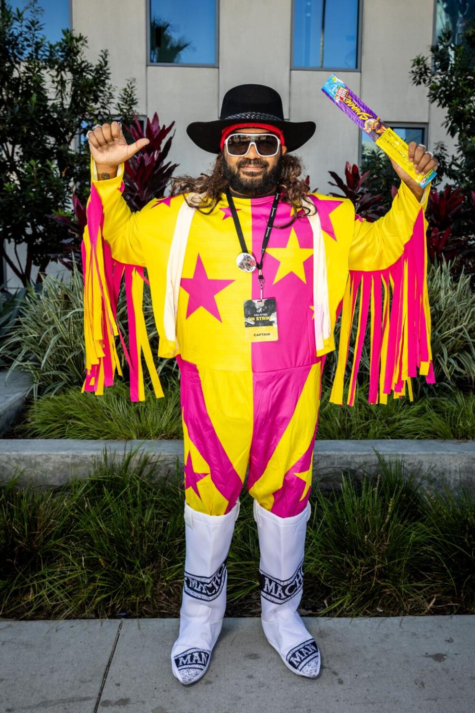 Adrian Dev, a strike captain and also, Randy "Macho Man" Savage, snapping into a Slim Jim, while walking the Halloween line