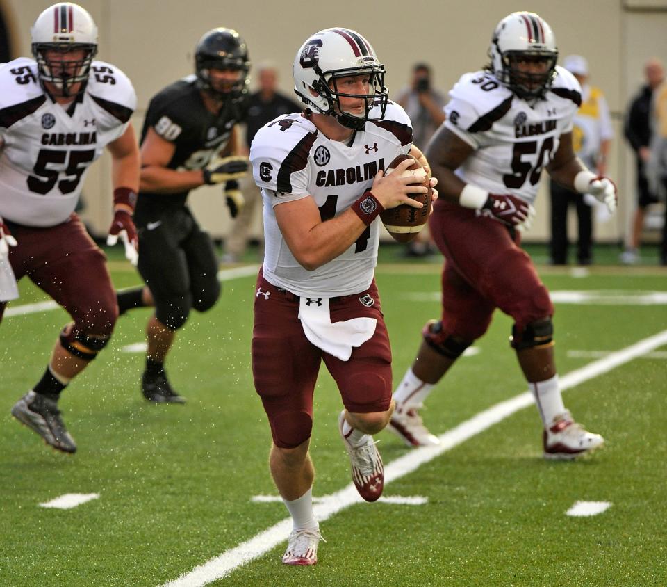 Quarterback Connor Shaw #14 carries the ball against the Vanderbilt Commodores at Vanderbilt Stadium on August 30, 2012 in Nashville, Tennessee. (Photo by Frederick Breedon/Getty Images)