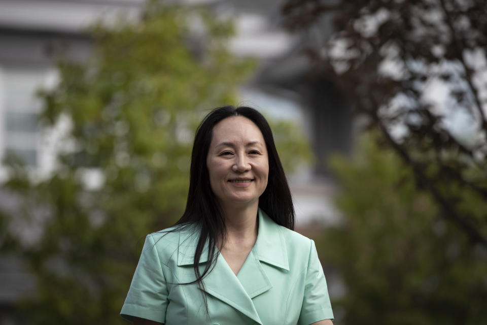 Meng Wanzhou, chief financial officer of Huawei, smiles as she leaves home to attend her extradition hearing at B.C. Supreme Court, in Vancouver, British Columbia, Monday, Aug. 9, 2021. (Darryl Dyck/The Canadian Press via AP)