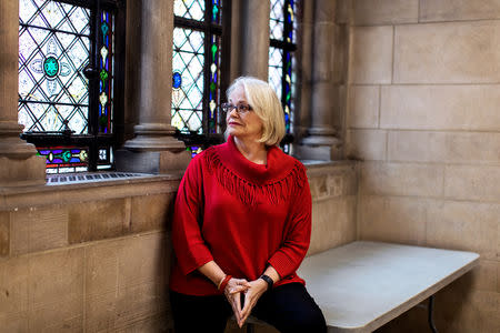 Artist Betsy Ashton poses for a portrait at Riverside Church in New York, U.S., March 10, 2019. Betsy has her "Portraits of Immigrants: Unknown Faces, Untold Stories" on display until April 22, 2019. REUTERS/Demetrius Freeman