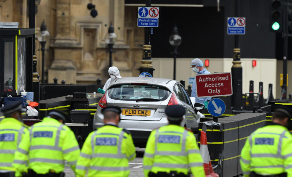 Police forensics teams examine the vehicle (Picture: Getty)