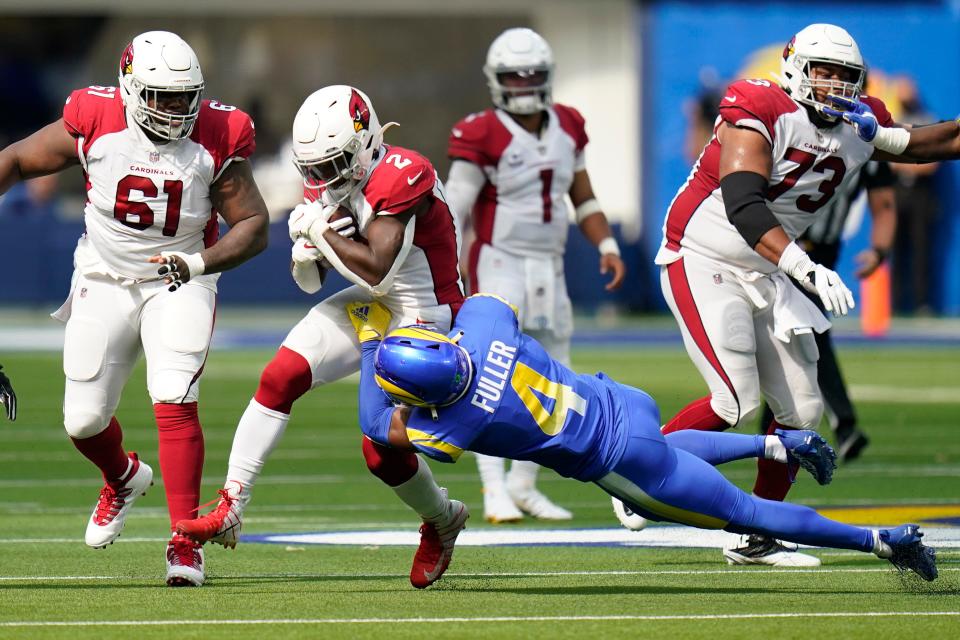 Arizona Cardinals running back Chase Edmonds is tackled by Los Angeles Rams safety Jordan Fuller (4) during the first half in an NFL football game Sunday, Oct. 3, 2021, in Inglewood, Calif. (AP Photo/Jae C. Hong )