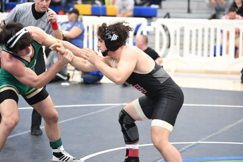 Fleming Island's Christopher Chop wrestles against Lake Gibson in the state duals. Chop won the 160-pound division of the Region 1-2A championship for the Golden Eagles.