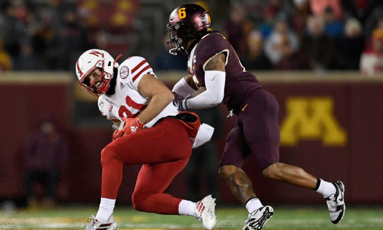 Nebraska football captain Kade Warner catches pass against Minnesota.