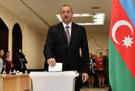 Azerbaijan's President Ilham Aliyev casts his vote during a referendum on extending presidential terms in Baku, Azerbaijan, September 26, 2016. REUTERS/AZERTAC/Vugar Amrullayev/Pool