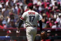 Los Angeles Angels' Shohei Ohtani walks off the field after being taken out of the game during the second inning in the first baseball game of a doubleheader against the Cincinnati Reds Wednesday, Aug. 23, 2023, in Anaheim, Calif. (AP Photo/Mark J. Terrill)