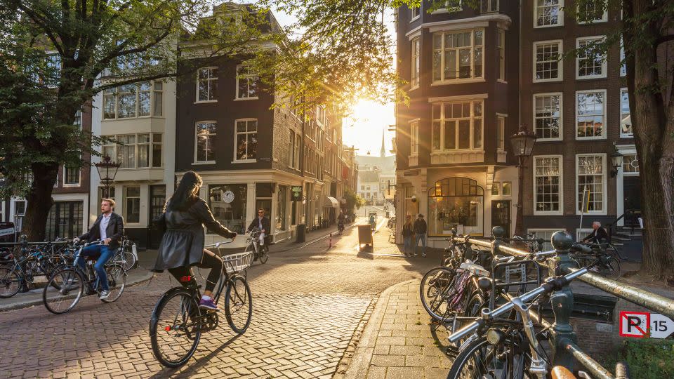 The Netherlands is among the happiest countries on the planet, according to pollsters Gallup. Bicyclists are sure to be at home in Amsterdam (above) and other cities in the Netherlands. - a_Taiga/iStock Editorial/Getty Images