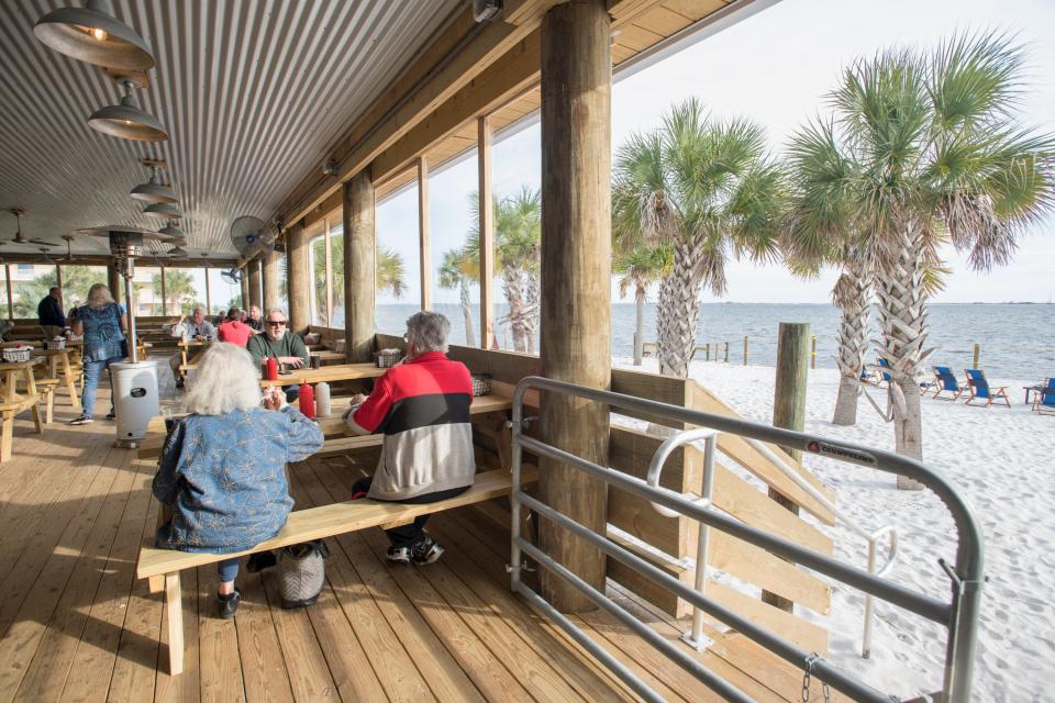 The dining room overlooks Santa Rosa Sound at the new Dewey Destin Seafood Restaurant in Navarre on Thursday, November 29, 2018.