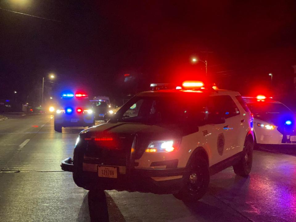 Des Moines police cars close down the intersection at SE 14th Street and Watrous Avenue after police said an officer struck by a vehicle Monday, Dec. 6, 2021.