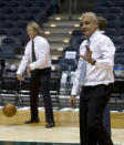 New York investment firm executives Marc Lasry, left, and Wesley Edens shoot baskets in the Bradley Center before a news conference with Milwaukee Bucks owner Herb Kohl after reaching a deal to sell the franchise Wednesday, April 16, 2014, in Milwaukee. (AP Photo/Morry Gash)