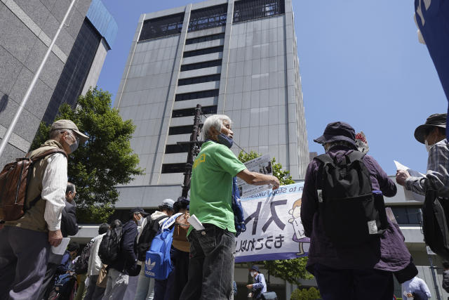 Some protesters gather for a rally outside Tokyo Electric Power Company Holdings (TEPCO) headquarters building Tuesday, May 16, 2023, in Tokyo. Dozens of anti-nuclear activists gathered outside of the Tokyo utility operating a tsunami-wrecked Fukushima nuclear power plant and demanded Japan scrap its plan to start releasing into sea massive stockpile of treated but still radioactive water. (AP Photo/Eugene Hoshiko)