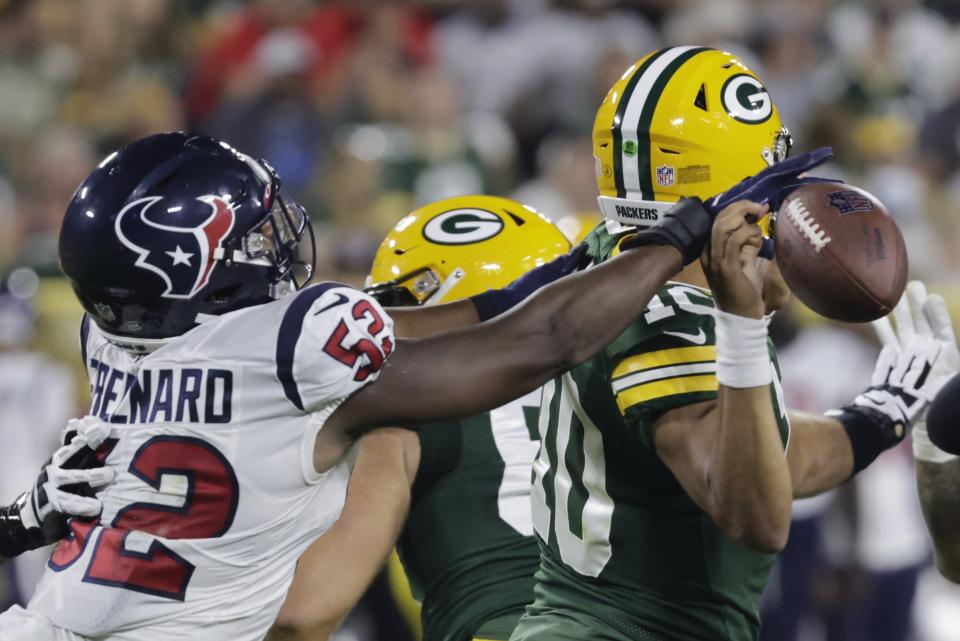 Houston Texans' Jonathan Greenard causes a fumble by Green Bay Packers' Jordan Love during the first half of a preseason NFL football game Saturday, Aug. 14, 2021, in Green Bay, Wis. (AP Photo/Mike Roemer)