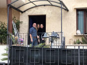 Avalanche survivor Giorgia Galassi, wearing black at right, smiles with her parents mother Isa Toccotelli, center, and Tomasso Galassi, at their home in Giulianova, Italy, Monday, Jan. 23, 2017. Galassi and her boyfriend Vincenzo Forti were at the Hotel Rigopiano when the avalanche buried the hotel on Jan. 18 and were rescued three days later. (AP Photo/Colleen Barry)