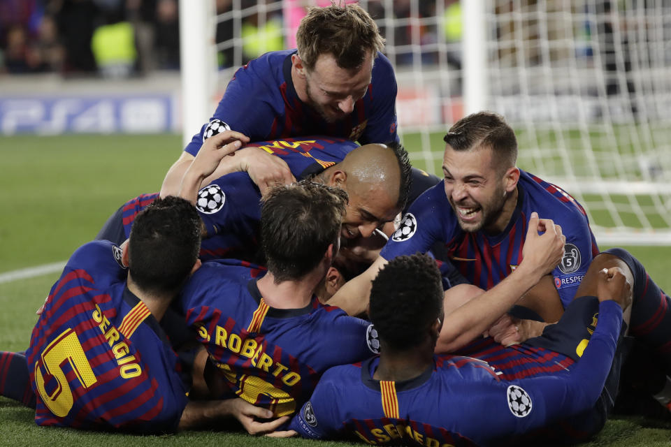 Barcelona players celebrate after Lionel Messi scored his side's third goal during the Champions League semifinal, first leg, soccer match between FC Barcelona and Liverpool at the Camp Nou stadium in Barcelona, Spain, Wednesday, May 1, 2019. (AP Photo/Emilio Morenatti)