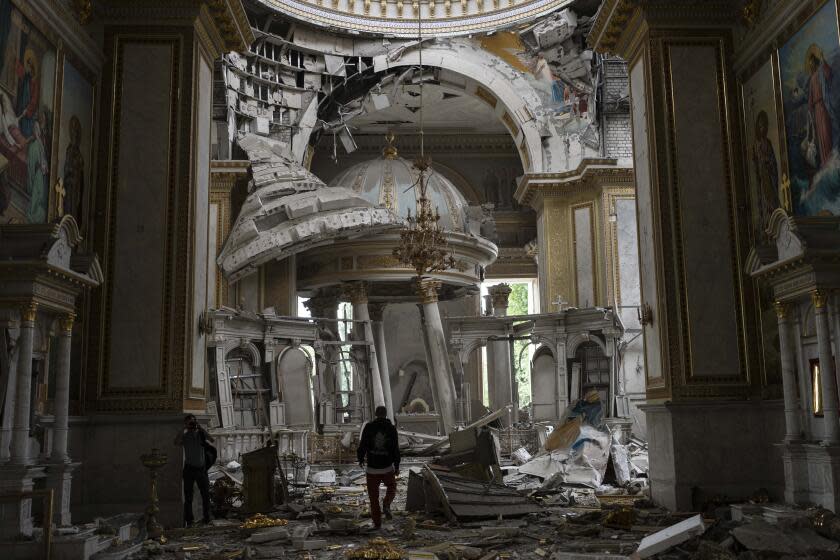 Church personnel inspect damages inside the Odesa Transfiguration Cathedral in Odesa, Ukraine, Sunday, July 23, 2023, following Russian missile attacks. (AP Photo/Jae C. Hong)